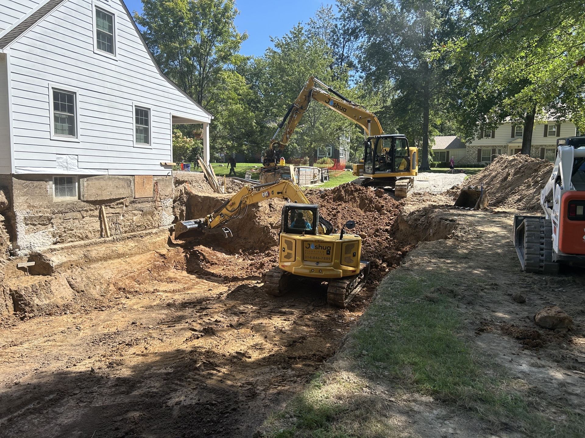 Joshua Plumbing excavator at a St. Louis foundation excavation worksite