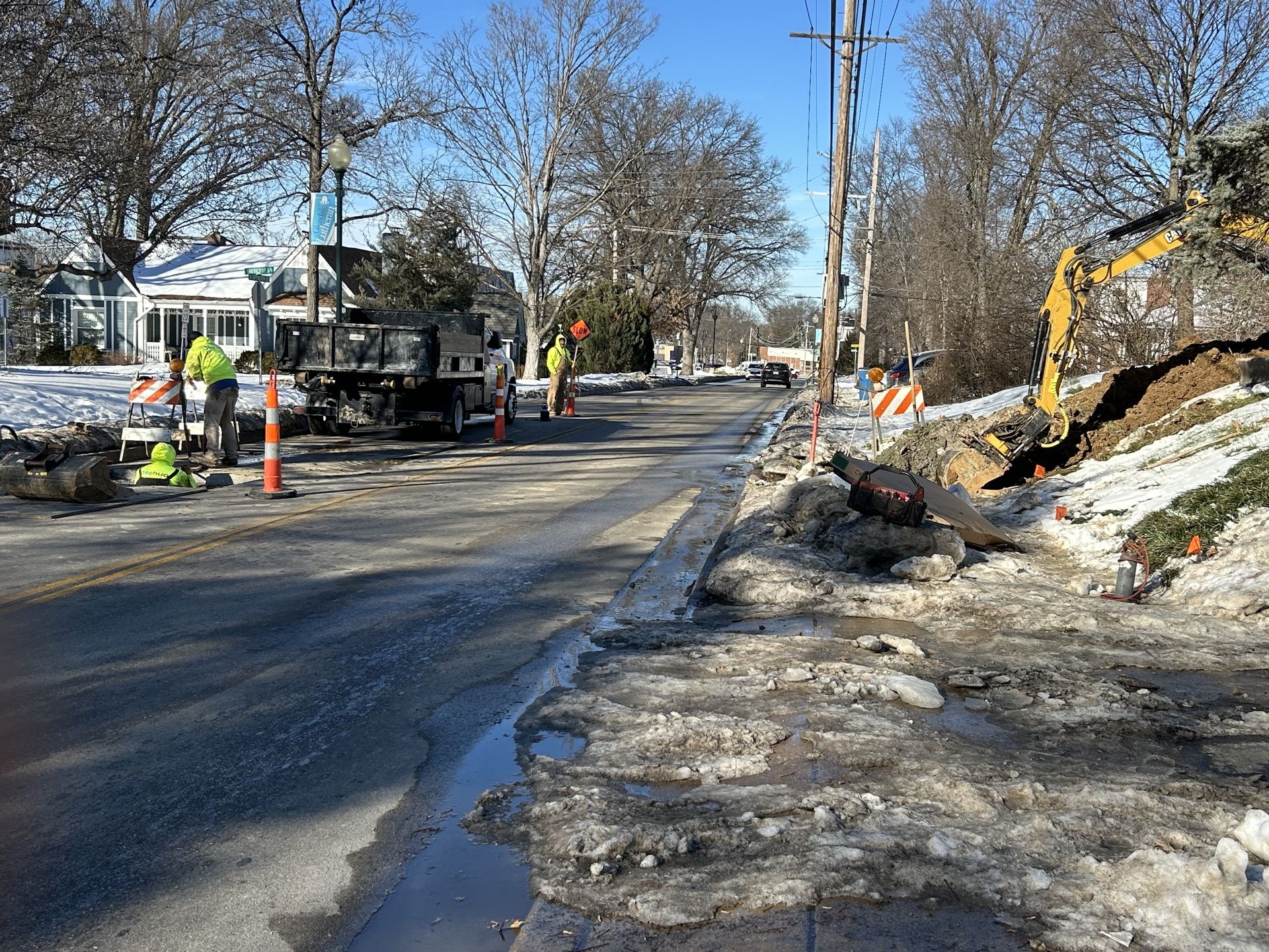 Joshua Plumbing crew repairing a water service line in St. Louis winter conditions